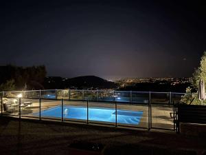 a view of a swimming pool at night at Gite Mare e Montagne Drap 06 in Drap