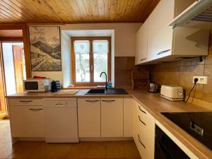 Køkken eller tekøkken på Le Lodge des Aulps