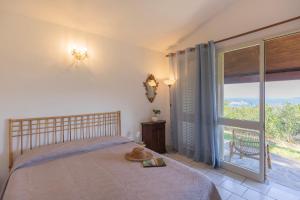 Postel nebo postele na pokoji v ubytování Villetta Azzurra by ElbaSummer