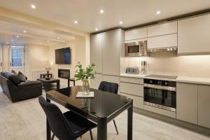 a kitchen and living room with a table and chairs at Host & Stay - Ross's View in Whitby