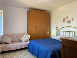 Ένα ή περισσότερα κρεβάτια σε δωμάτιο στο Grazioso Appartamento in Centro con Vista