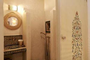 a bathroom with a shower and a mirror at Riad Beata - Private use option - in Marrakech +44 photos