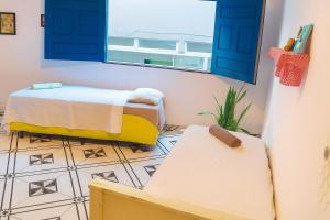 Ένα ή περισσότερα κρεβάτια σε δωμάτιο στο Tranquilandia Guest House