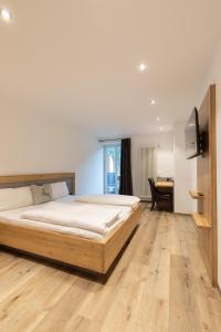 Ένα ή περισσότερα κρεβάτια σε δωμάτιο στο Landgasthaus Grüner Baum