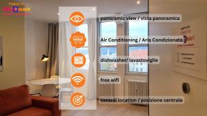 una stanza con una finestra con adesivi arancioni sul muro di Campo Marzio 6 a Trieste