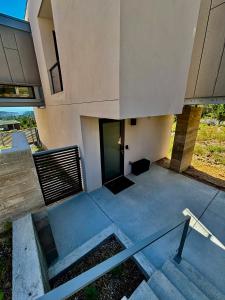 a building with stairs leading up to a door at Casita in Los Alamos +17 photos