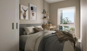 En eller flere senge i et værelse på Modern apartment by the sea