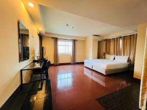 Giường trong phòng chung tại NSC Apartel