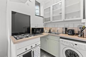 Η κουζίνα ή μικρή κουζίνα στο 2Bed apartment 2 King zip&link Workspace Parking Wi-Fi