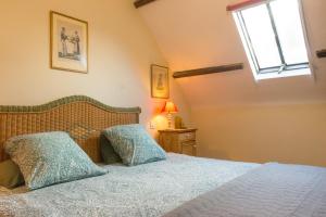 En eller flere senge i et værelse på Carnac: Maison chaleureuse, calme proche plages