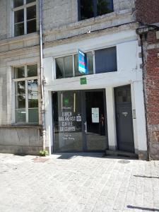 a brick building with a sign in the doorway at Noël centre Lille in Lille