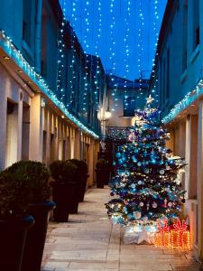 a christmas tree in the middle of a street at Hotel De L'Horloge in Paris