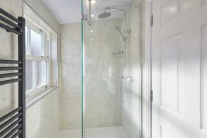 a shower with a glass door in a bathroom at Host & Stay - Ross's View in Whitby