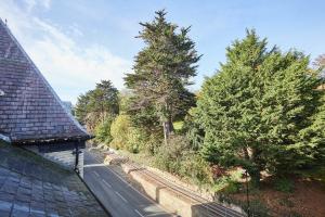 a road with trees on the side of a house at Host & Stay - Ross's View in Whitby