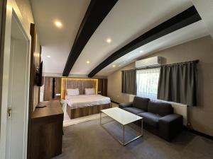 Ένα ή περισσότερα κρεβάτια σε δωμάτιο στο Anatolia Luxury Hotel +20 φωτογραφίες