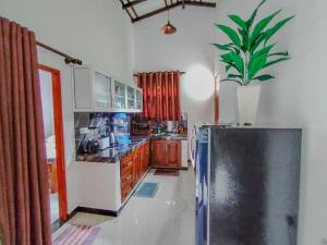 Η κουζίνα ή μικρή κουζίνα στο Villa Pabasara