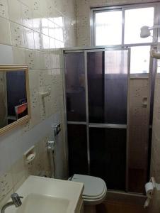 a bathroom with a shower and a toilet and a sink at Hospedaje en lapa in Rio de Janeiro
