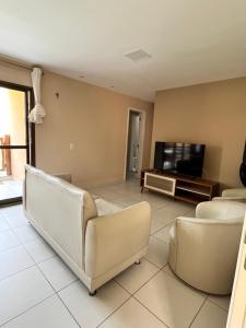 TV a/nebo společenská místnost v ubytování Apartamento B2 106 + 4 fotografie