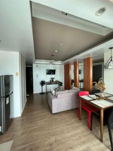 a living room with a couch and a table at Abreeza Tower 1 in Davao City