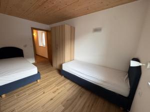 En eller flere senge i et værelse på Casa Vittoria