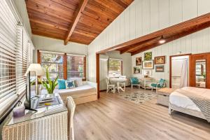 a bedroom with a bed and a desk at Oak Grove Escape with Shared Deck & Direct Beach Access in Englewood +50 photos