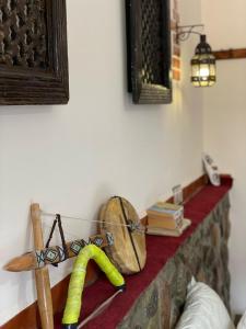 a shelf with a bunch of items on a wall at lake view, comfortable artistic design in Ouirgane
