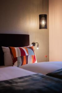 Ένα ή περισσότερα κρεβάτια σε δωμάτιο στο Landgasthaus & Hotel zur Krone