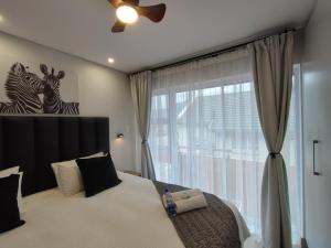 Ένα ή περισσότερα κρεβάτια σε δωμάτιο στο Duplex 59 - 1 on York