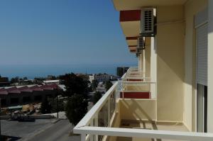 a balcony of a building with a view of a city at Byblos Guest House in Jbeil