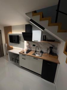 Η κουζίνα ή μικρή κουζίνα στο NOBBY SKIATHOS LUXURY APARTMENTs