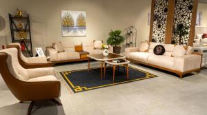 a living room with couches and a table and a couch at Tranquility luxury hotel and apartment in Rubuchi