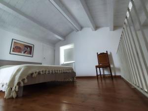 Ένα ή περισσότερα κρεβάτια σε δωμάτιο στο Al Portico 38