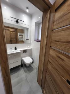 Koupelna v ubytování AS ELITE Apartament -Studio Centrum parking