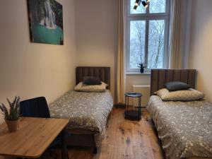 Postel nebo postele na pokoji v ubytování AS ELITE Apartament -Studio Centrum parking