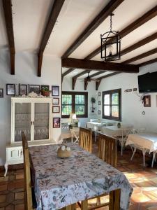 a kitchen and dining room with a table and chairs at Hotel Rural Hacienda de Ronda in Ronda