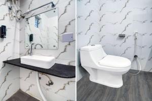 a bathroom with a white toilet and a sink at HOTEL O HAPPY PLACE HOTEL & RESORT in Gaya +30 photos