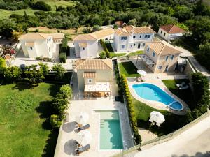 an aerial view of a house with a swimming pool at Vasilopoulos Residences - Villa Anthia with jaccuzzi & Villa Emelia with shared pool in Argostoli