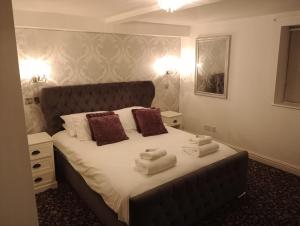 Ένα ή περισσότερα κρεβάτια σε δωμάτιο στο Whiston Hall