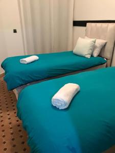 En eller flere senge i et værelse på Belle résidence avec piscine à Marrakech