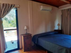 Ένα ή περισσότερα κρεβάτια σε δωμάτιο στο Dpto Vista Alago