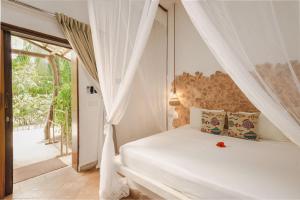 Ένα ή περισσότερα κρεβάτια σε δωμάτιο στο Mvuvi Boutique Resort +206 φωτογραφίες