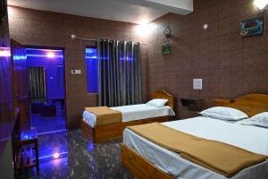 Ένα ή περισσότερα κρεβάτια σε δωμάτιο στο Indraprastha Residency +9 φωτογραφίες