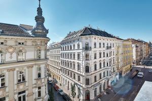 an aerial view of buildings in a city at 6 rooms Naschmarkt in Vienna