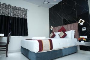 Postel nebo postele na pokoji v ubytování The Orange Hotel + 3 fotografie