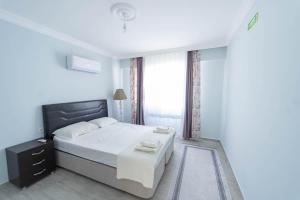 En eller flere senge i et værelse på Villa Albatros + 14 billeder