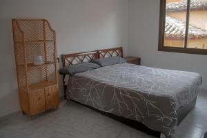 a bedroom with a bed and a mirror and a shelf at Toledo Downtown - Apartment for 6 in Toledo