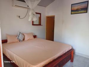 a bedroom with a bed in a room at Walawa cottage udawalawe in Udawalawe +21 photos