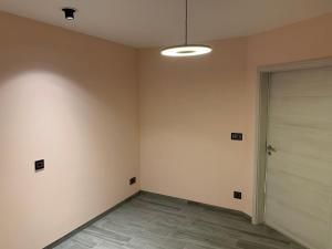 an empty room with a door and a hallway at Ourthe Basse in La Roche-en-Ardenne +1 photo