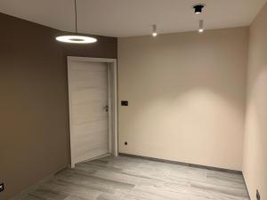 an empty room with a door and a hallway at Ourthe Basse in La Roche-en-Ardenne