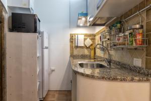 Køkken eller tekøkken på La casetta di Pietra + 8 billeder